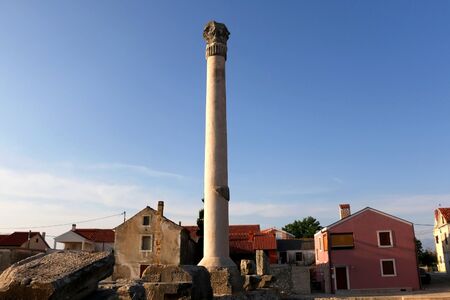 Ruins of ancient Roman temple from first century in small town Nin, Croatia.の写真素材