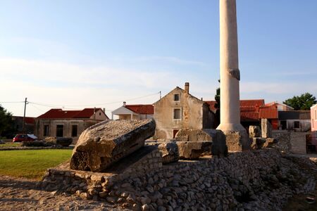 Ruins of ancient Roman temple from first century in small town Nin, Croatia.の写真素材