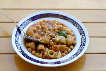Plate of pasta, chickpea and shrimp stew. Selective focus.の写真素材