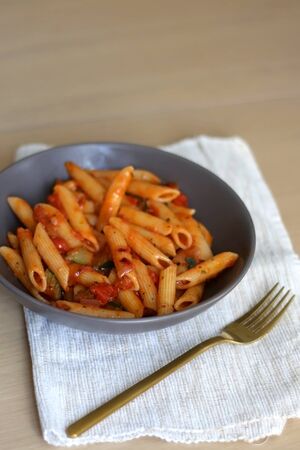 Plate of pasta with tomato sauce and eggplant. Selective focus.の写真素材