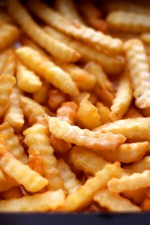 Curly fries in a box. Take away food. Selective focus.の写真素材