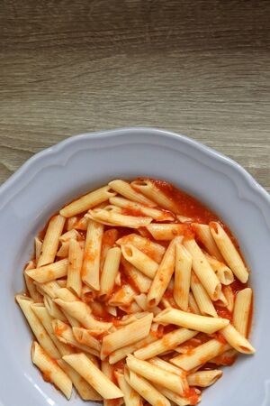 Plate of pasta with homemade tomato sauce. Flat lay.の写真素材