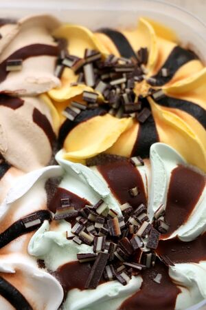 Ice cream with four flavors: pistachio, vanilla, banana and hazelnut. Selective focus.の写真素材