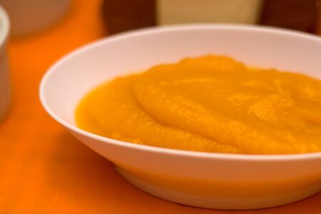 Homemade pumpkin puree on a table. Selective focus.の写真素材