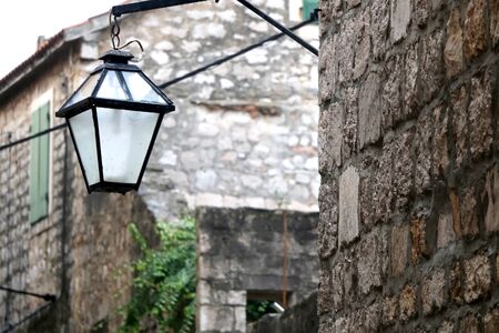 Retro lamp on a traditional stone Mediterranean building in Stari Grad, on island Hvar, Croatia.の写真素材