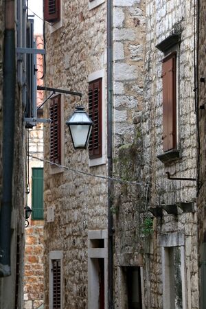 Retro lamp on a traditional stone Mediterranean building in Stari Grad, on island Hvar, Croatia.の写真素材