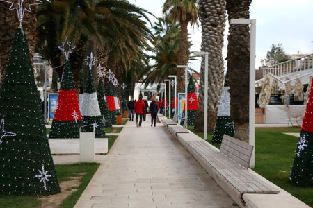 January 2, 2019: Christmas decorations on Riva promenade in Split, Croatia. People walkign and enjoying the atmosphere. Selective focus.のeditorial素材