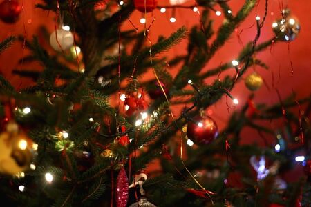 Colorful decorations on a Christmas tree. Selective focus.の写真素材