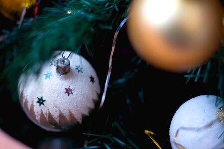 Traditional decorations on a Christmas tree. Selective focus.