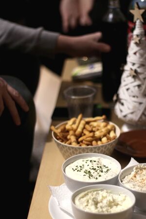 Various cheese dips and snacks on holiday party table. Selective focus.