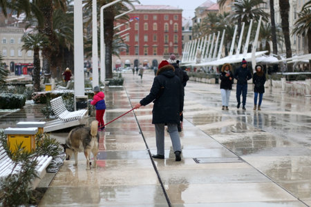Split, Croatia - February 26, 2018: People enjoying rare snowy day in central Split, Croatia.Split, Croatia - February 26, 2018: People enjoying rare snowy day in central Split, Croatia.のeditorial素材