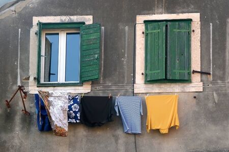 Mediterranean style rustic window and clothes drying outdoor in Split, Croatia.の写真素材