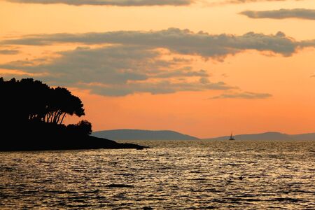 Beautiful sunset on a beach in Sutivan, island Brac, Croatia.の写真素材