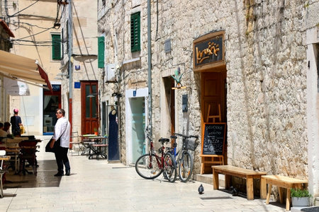 Split, Croatia - June 24, 2019: Picturesque alley with shops and restaurants in central Split, Croatia.のeditorial素材