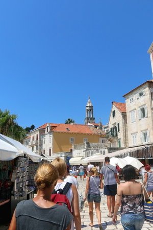 Hvar, Croatia - August 7, 2015: Tourists and locals enjoying sunny summer day in town Hvar, on island Hvar, Croatia. Hvar is popular summer travel destination.のeditorial素材