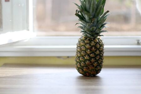 Fresh pineapple on a table. Selective focus.の写真素材