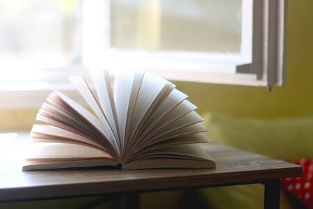 Open book on a table. Selective focus.の写真素材