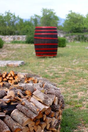 Stack of logs in the countryside. Selective focus.