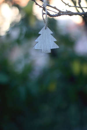 Christmas tree ornament hanging in the garden. Selective focus.の写真素材