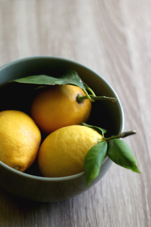 Bowl of lemons on a table. Selective focus.の写真素材