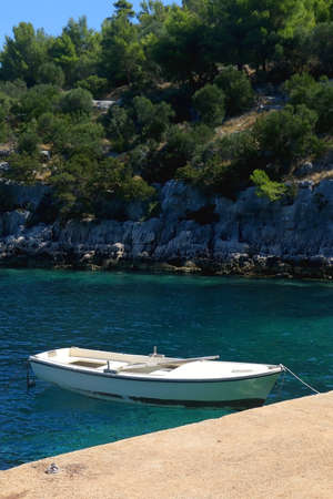 Small boat and beautiful clear sea on island Lastovo, Croatia.