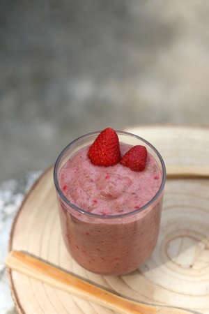 Banana and berry nice cream, served in a garden. Selective focus.の写真素材