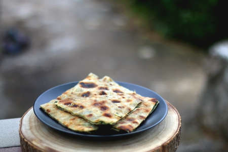 Thin dough filled with mangold, garlice and olive oil. Traditional food in Dalmatia, Croatia. Selective focus.の写真素材