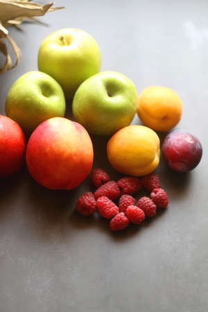 Various colorful fruit on dark background. Selective focus.