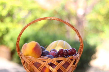 Vintage basket filled with various fruit. Selective focus.の写真素材