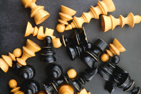 Vintage wooden chess pieces on dark background. Flat lay.の写真素材