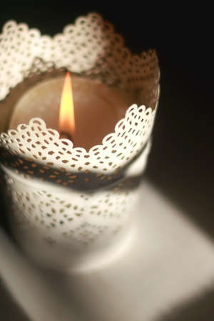 Candle holder with lit candle. Selective focus.の写真素材