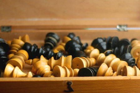 Wooden box with vintage chess pieces. Selective focus.