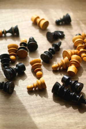 Vintage wooden chess pieces on the table. Selective focus.