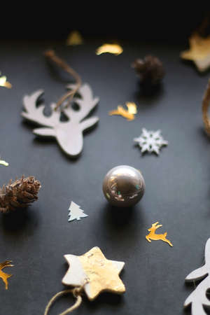 Various Christmas ornaments and colorful sequins on dark background. Selective focus.の写真素材