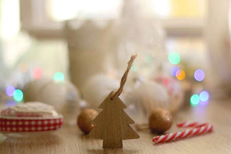 Various Christmas ornaments, candles and colorful bokeh lights. Selective focus.