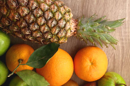 Various healthy fruit and vegetable on wooden background. Top view.の写真素材