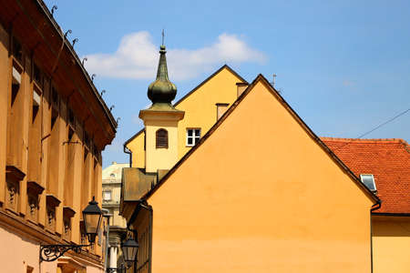 Colorful historical buildings and vintage street lantern in central Zagreb, Croatia.