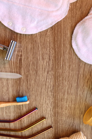 Various zero waste beauty products and kitchen utensils on wooden background. Top view.の写真素材