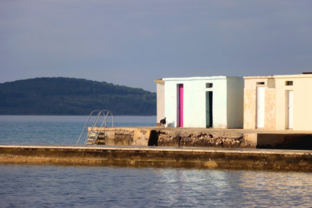 Colorful changing cabins, landmark on beach Jadrija, in Sibenik, Croatia.の写真素材