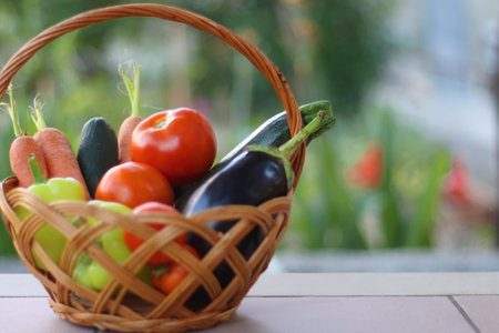 Basket with fresh seasonal vegetables, picked in the garden. Selective focus.の写真素材