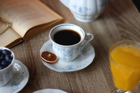 Cup of tea or coffee, plate of cookies, cup of blueberries, plate of chocolate, glass of juice,...