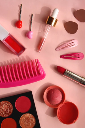 Various pink accessories and make up products on bright pink background. Flat lay.の写真素材