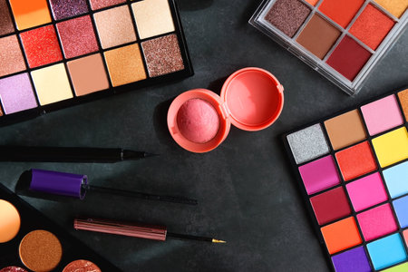 Various colorful make up products on dark background. Flat lay.の写真素材