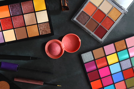 Various colorful make up products on dark background. Flat lay.の写真素材