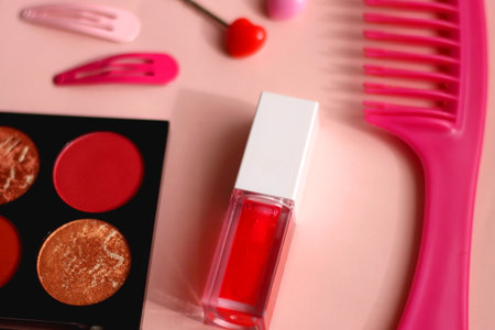 Various pink accessories and make up products on bright pink background. Selective focus.の写真素材