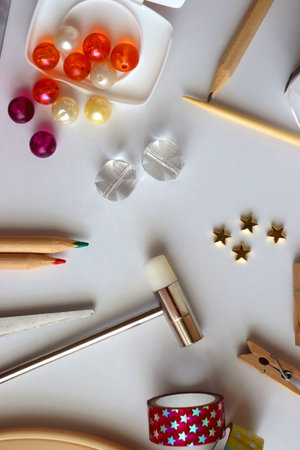 Various craft supplies on white background. Supplies for jewelry making, drawing and needlework....