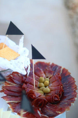 Table with various Mediterranean finger food. Garden party buffet. Selective focus.