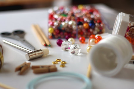 Various craft supplies on white background. Supplies for jewelry making, drawing and needlework. Selective focus.の写真素材