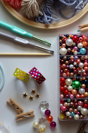 Various craft supplies on white background. Supplies for jewelry making, drawing and needlework. Flat lay.の写真素材