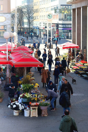 Zagreb, Croatia - March 13, 2022: Traditional red umbrellas on Dolac market in Zagreb, Croatia. Locals and tourists are shopping for fresh produce and flowers.のeditorial素材